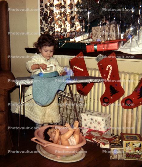 Little Girl Ironing, doll, stockings, presents, 1950s