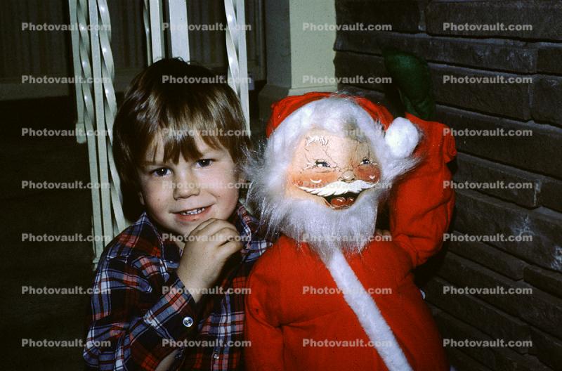 Boy With Santa Claus Doll, Smiles