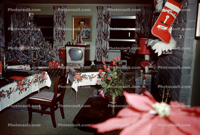 Christmas scene, living room, television. table, stocking, decorated tree, 1950s