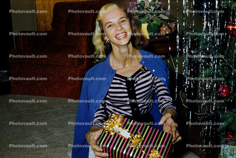 Cute Lady with Present, Smiles, Teeth, neck, punk hairdo, 1950s