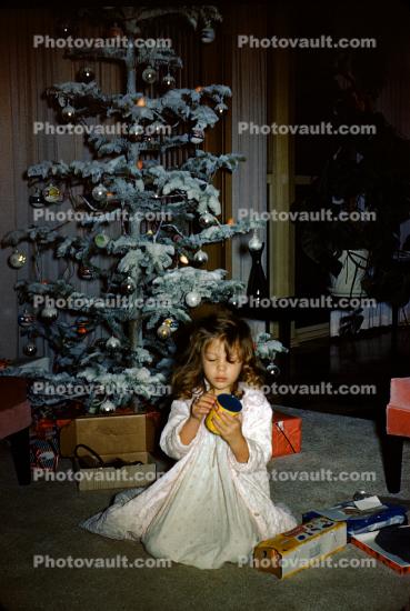 Girl, nighty, decorated tree, December 1959, 1950s