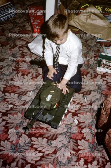 Boy with his Remotely Controlled Army Tank, December 1964