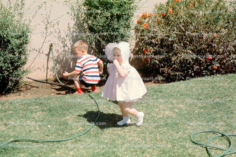 Girl with Bonnet, Backyard, Hose, Boy, Lawn, April 1965, 1960s