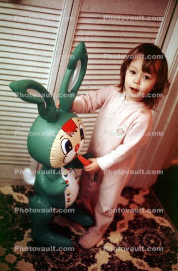 Girl in a onsie, pajamas, carrot, blow up bunny rabbit, funny, nightwear, 1960s
