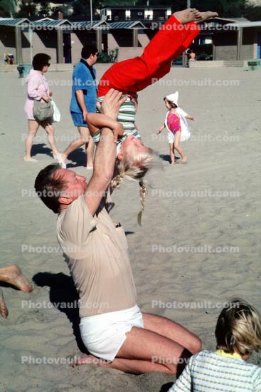 Grandpa Playing in the sand with grandaughters, Laguna Beach