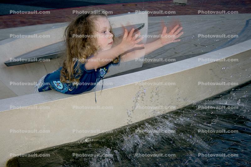 Girl playing at a Water Fountain, aquatics