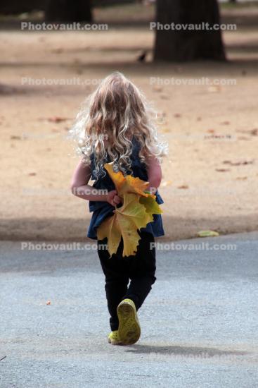 Girl with Yellow Leaves, walking