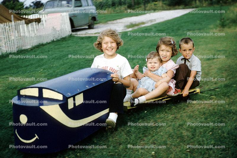 backyard train, Girls, Boys, Smiles, Miniature Train, Riding, smiling, cute, Akron Ohio, 1950s
