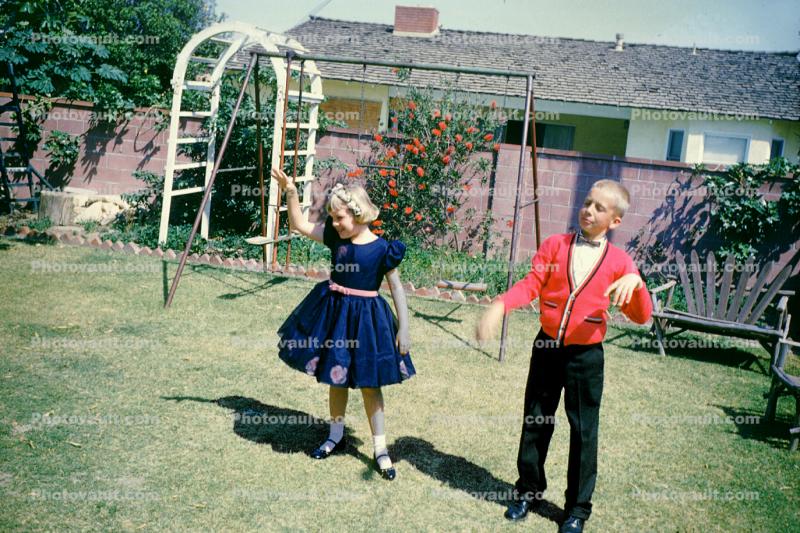 Backyard, boy, girl, dress, dressy, formal, April 1960, 1960s