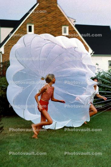 Playing with a Parachute, girl, running, barefoot, lawn, 1960s