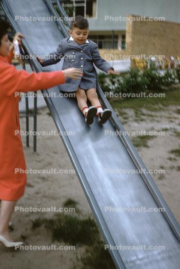 Boy Sliding, mother, coat, 1950s