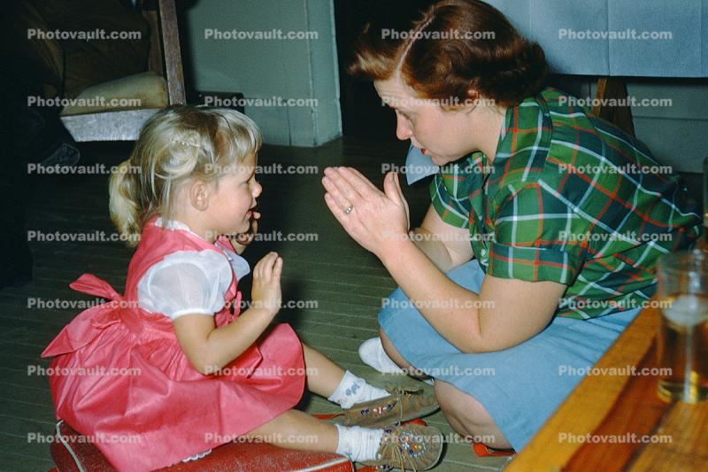 Playing Patty-Cake, hands, arms, dress, Mom, Daughter, 1950s