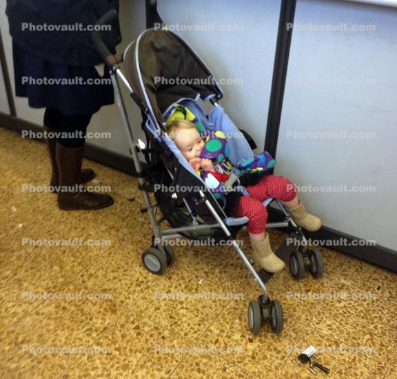 Toddler in a baby stroller, pram, pushcart, infant, baby, infant