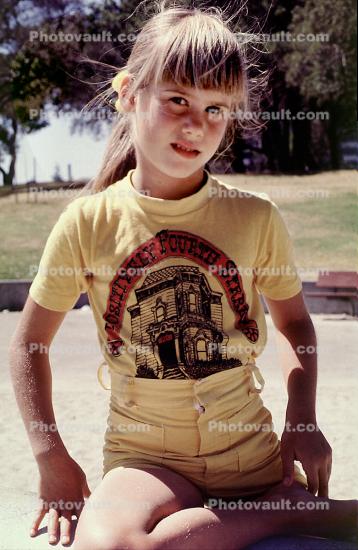 girl, female, hair, bangs, pants, shirt, park, sandbox, face, 1970s
