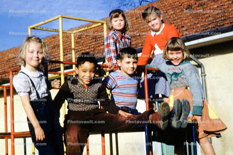 girls and boys on a junglegym, smiles, smiling, cute, 1952, 1950s