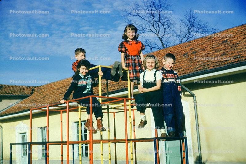 girls and boys on a junglegym, 1952, 1950s