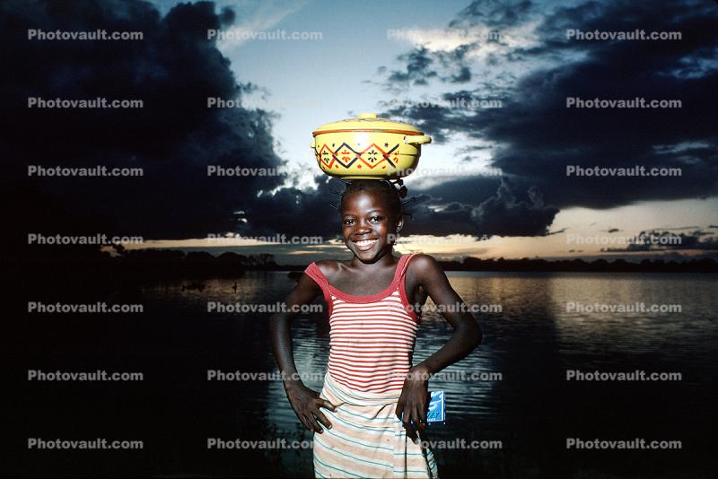 Girl, Smiles, Sunset Clouds at a Lake