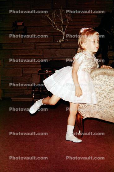 Girl in party dress, 1950s
