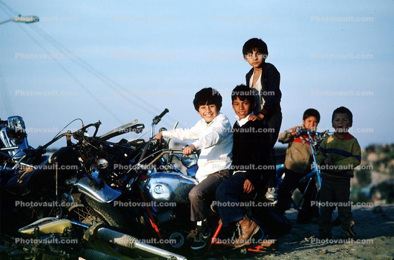 Boys in a Motorcycle Junkyard, Colonia Flores Magone