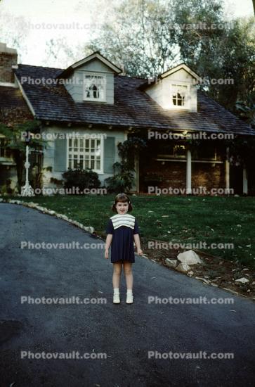 Girl in front of her House