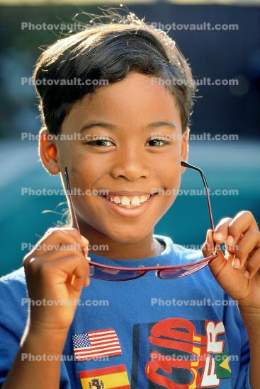 Boy with glasses and smiles