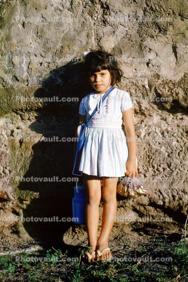 Girl Standing with a water bottle
