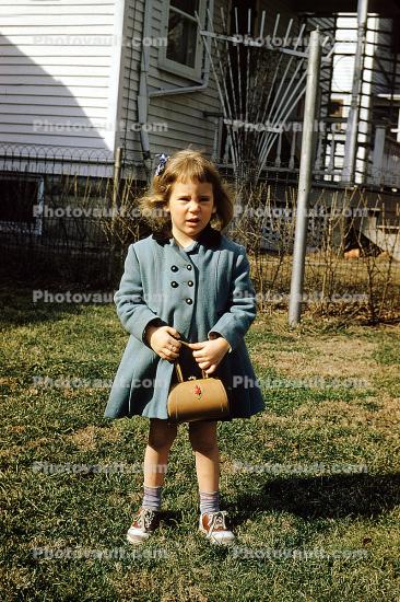 Little Girl with a purse, backyard, coat, cold, 1950s