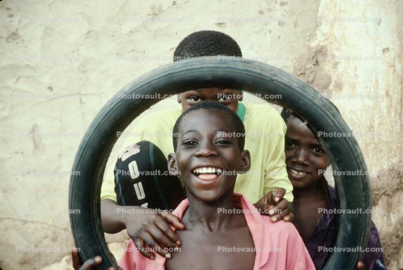 Laughing boys, smiles, tire