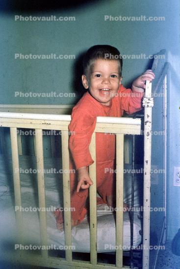 Toddler, cute, funny, smiles, crib, June 1960, 1960s