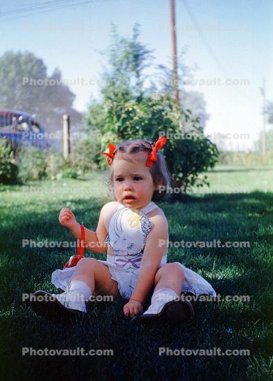 Girl sitting on the Lawn, 1950s