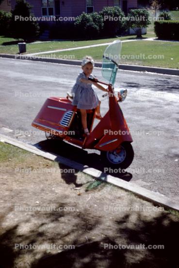 Vicky on Dads Scooter, 1950s