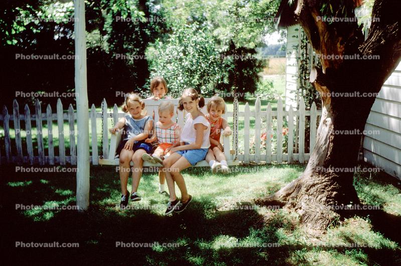 Children Sitting on a Backyard Swing, Girls, cute, funny, 1960s
