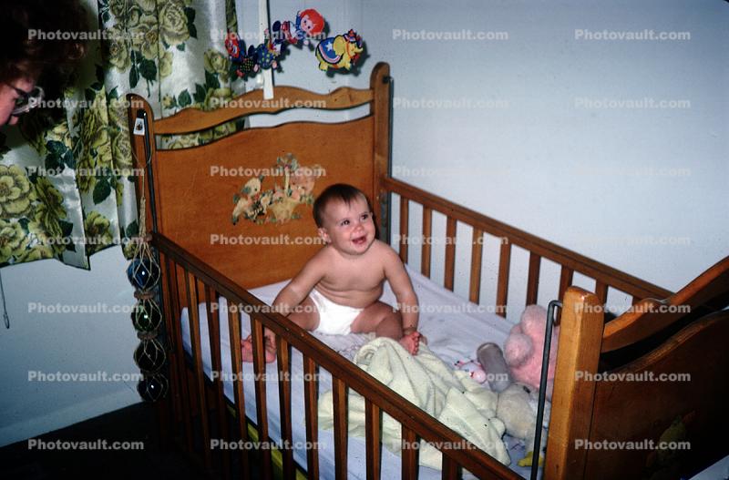 Baby Boy in a Crib Bed, smiles, cute, 1960s