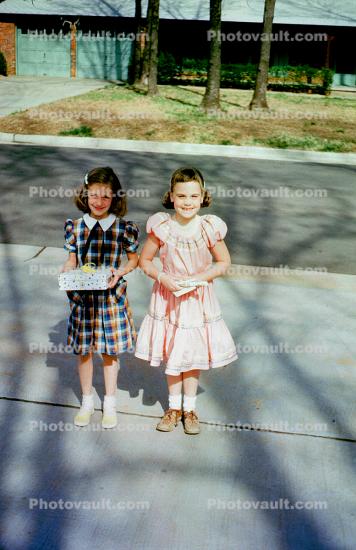 Birthday presents, girls, sidewalk, dress, smiles, smiling, 1940s