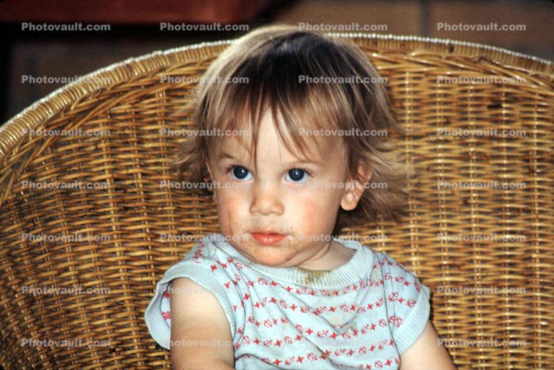 Girl, messy hair, muss, face, wicker chair, Erol, Gokyigit, July 1971, 1970s