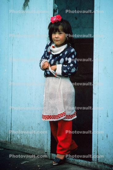 Girl standing, dress, sweater, Smarkand, Uzbekistan, 1950s