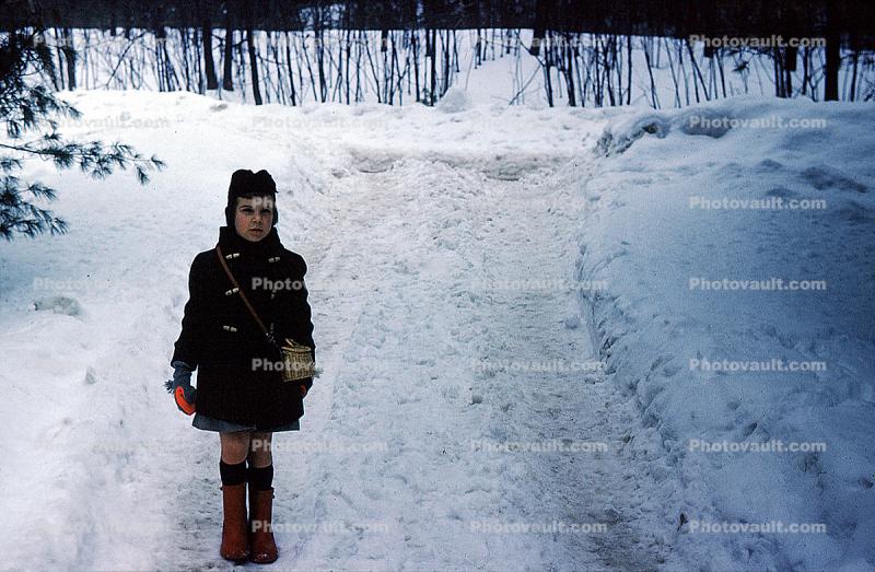 Girl in the snow, mittens, road, The Inn at Steele Hill, New Hampshire, 1950s