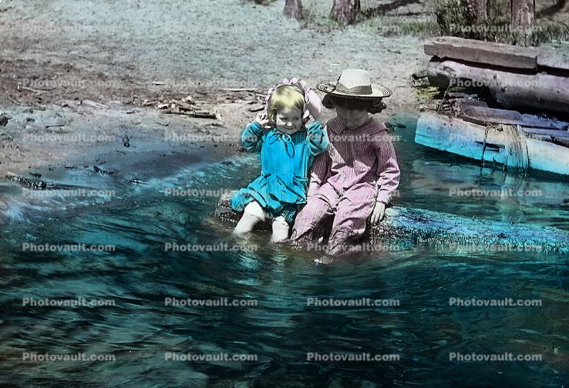 Two girls sitting by Pond, Postcard, 1910's