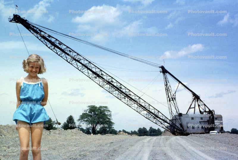 Girl and Huge Crane, smiles, 1950s