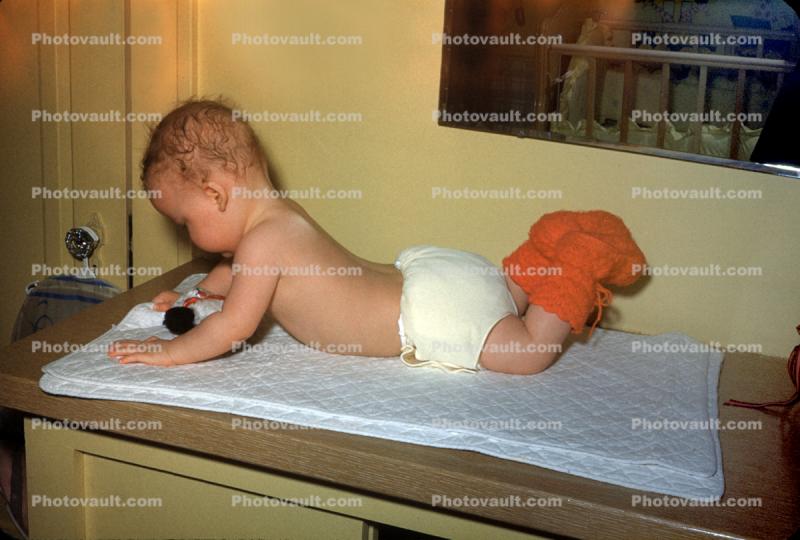 Boy at a diaper changing table, Toddler, 1950s
