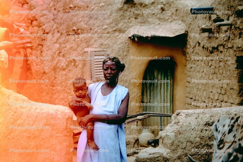 Mother with her child, home, building, Mud Brick House