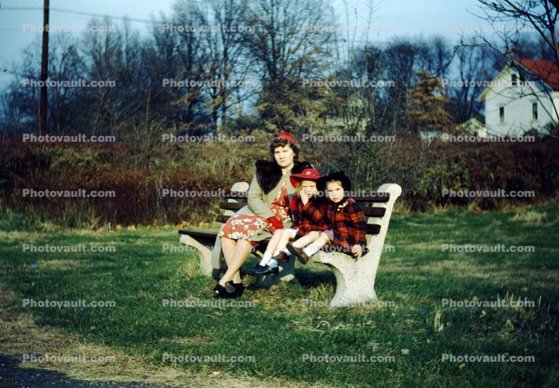 Mother with her sons, bench, 1950s