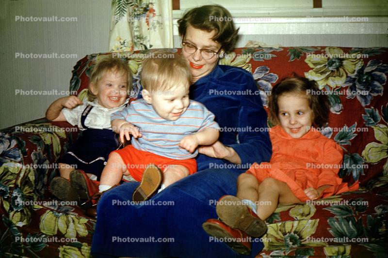Family on a Couch, girl, boy, smiles, flowers, 1940s