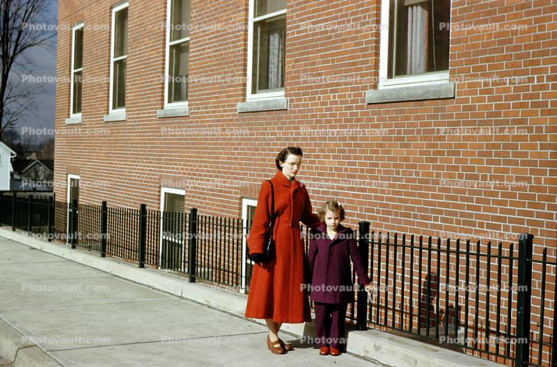 Mother with her Daughter, Brick Building, 1950s