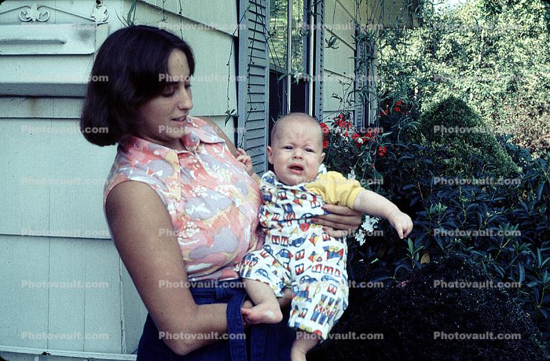 Mother with a Crying Baby, toddler, backyard, 1960s