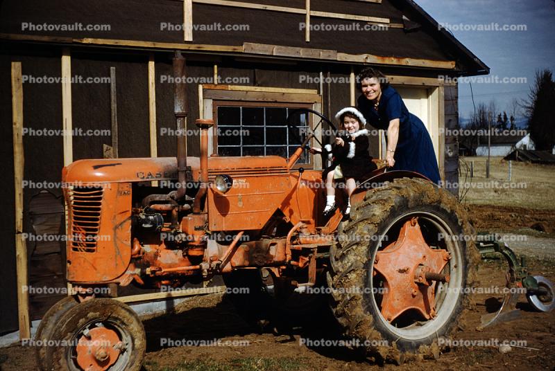 Mother and Daughter, Case Farm Tractor, 1950s