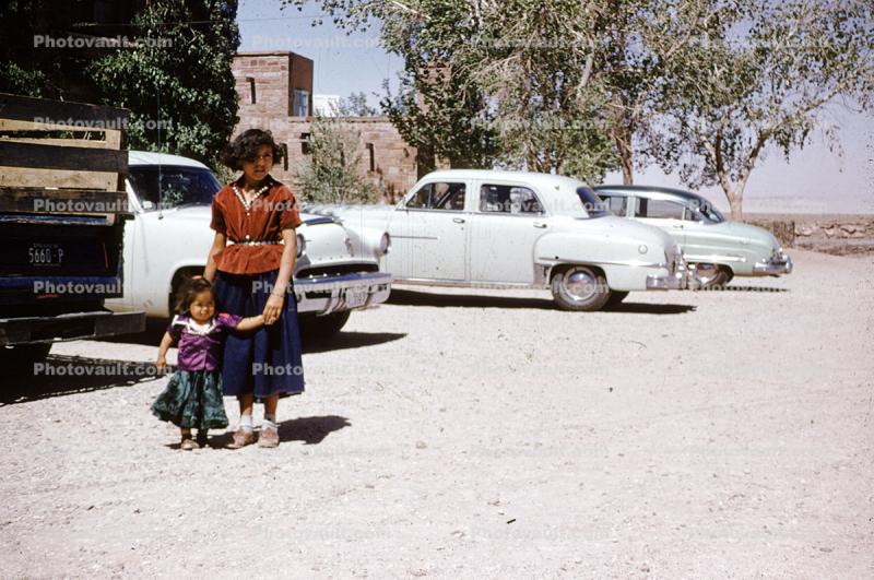 Mother and her Child in a parking Lot, Cars, 1950s