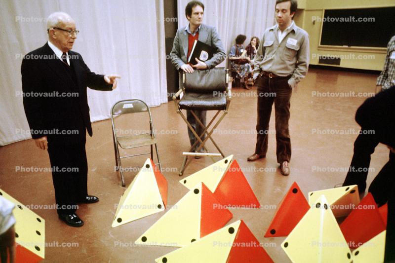 Bucky Pointing, Tetrahedron, Bucky preparing polyhedra models, "Conversations with Buckminster Fuller" event, Oakland, Polyhedra