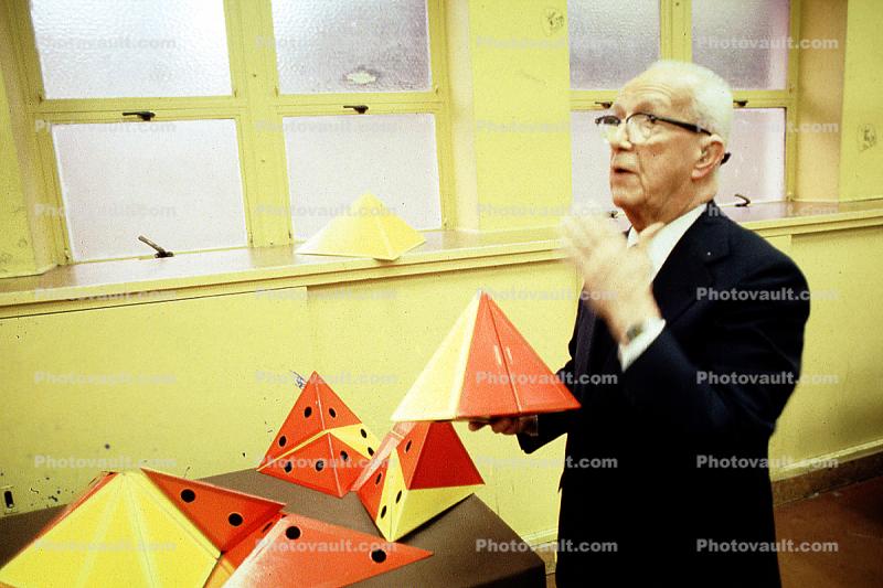 Bucky preparing polyhedra models, Tetrahedron, "Conversations with Buckminster Fuller" event, Oakland, Polyhedra
