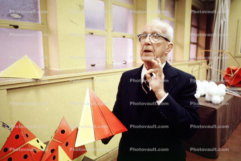 Bucky preparing polyhedra models, "Conversations with Buckminster Fuller" event, talking, hand, Oakland